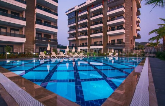 Квартира 1+1 с видом на море в районе Каргыджак в Турции - фото 2