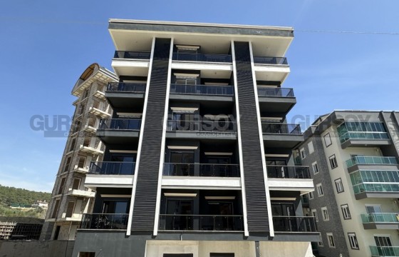 Небольшая квартира 1+1 в районе Авсаллар в Турции - фото 3