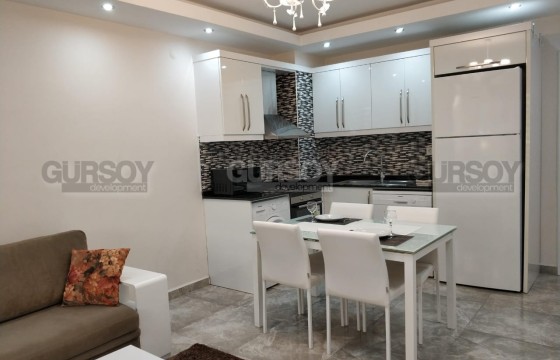 Меблированные апартаменты 1+1 в районе Оба в Турции - фото 2