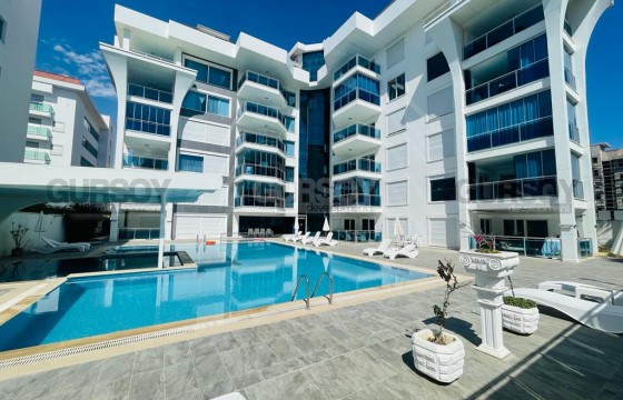 Стильная двухуровневая квартира в 50 метрах от моря в Турции - фото 2