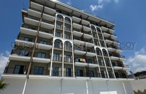 Уютная двухкомнатная квартира в новом комплексе по доступной цене в Турции - фото 5