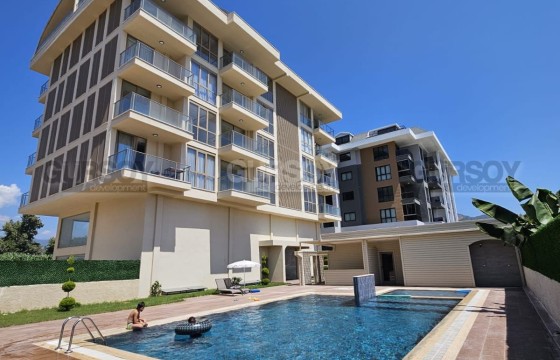 Квартира 1+1 в аренду с видом на горы в уютном комплексе в районе Каргыджак в Турции - фото 2