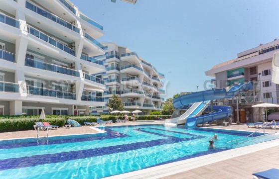 Современная двухкомнатная квартира в районе Джикджилли, в комплексе с полной инфраструктурой. в Турции - фото 4