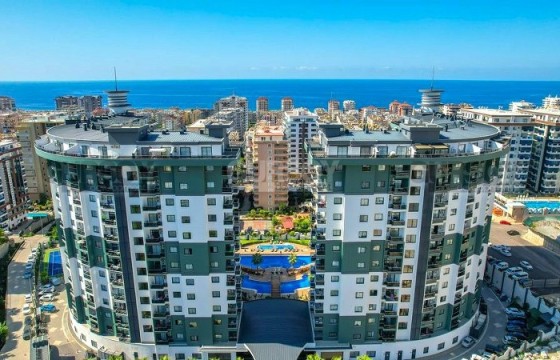 Двухкомнатные апартаменты в известном жилом комплексе с богатой инфраструктурой в районе Махмутлар в Турции - фото 1