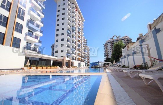 Квартира с двумя спальнями в комплексе с инфраструктурой на высоком этаже по очень приятной цене в Турции - фото 1