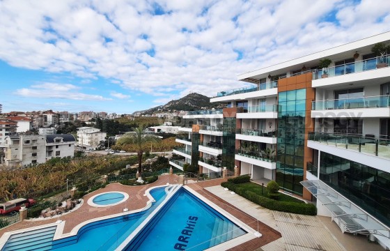 Квартира в живописном районе в современном комплексе с инфраструктурой в Турции - фото 4