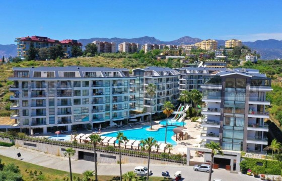 Квартира в стиле IKEA с прекрасным видом на горы и зелень в комплексе с отельной инфраструктурой в Турции - фото 4