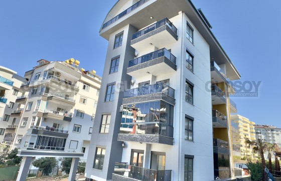 Квартира 1+1 с видом на море в новом комплексе в районе Тосмур в Турции - фото 8