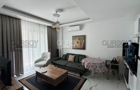 Уютные апартаменты 1+1 с видом на бассейн в современном жилом комплексе в Турции - фото 2