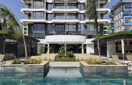 Квартира 2+1 в комплексе премиум класса на первой линии в Каргыджаке в Турции - фото 11