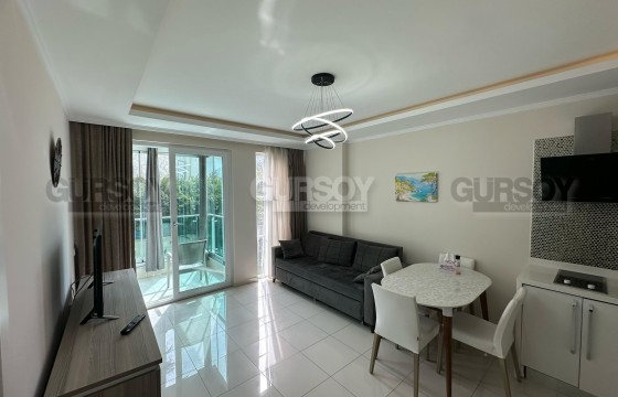 1+1 на первой линии с видом на море в районе Кестель в Турции - фото 11