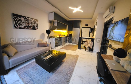 Меблированная 1+1 в новом доме в 50 метрах от моря в Турции - фото 2