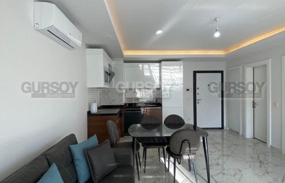 Квартира 1+1 с мебелью и техникой в районе Клеопатра в Турции - фото 2