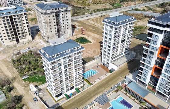 Современная квартира 1+1 в новом комплексе в центре Махмутлара в Турции - фото 5