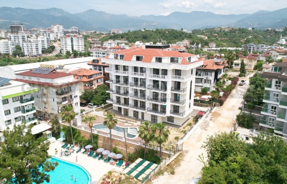 Новая квартира 1+1 в районе Кестель в Турции - фото 4