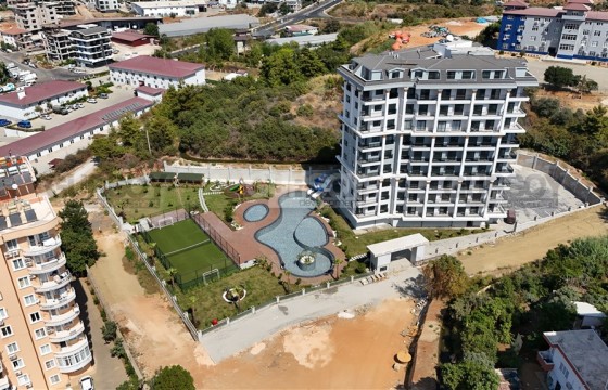 Новая квартира 1+1 в комплексе премиум-класса в районе Тосмур в Турции - фото 11