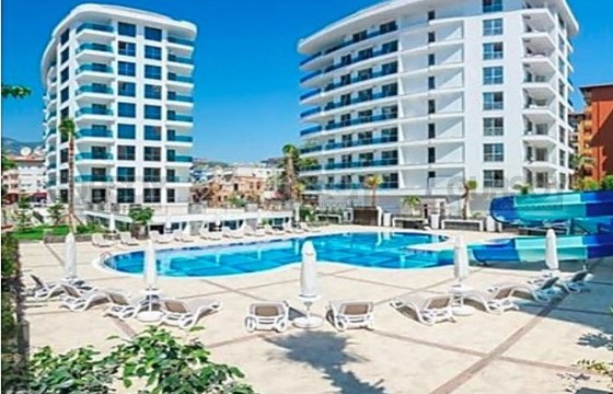 Просторная квартира 1+1 в престижном комплексе у пляжа Клеопатра в Турции - фото 2