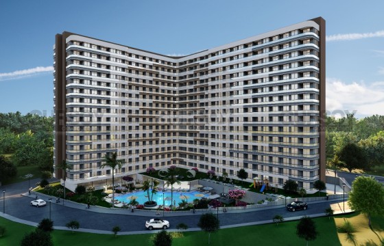 Новый инвестиционный проект на этапе котлована по уникальным ценам в районе Эрдемли, 62 м2- 89м2 в Турции - фото 1