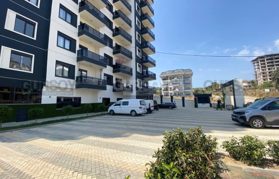 Уютная квартира 1+1 в комплексе с хорошей инфраструктурой и видом на горы в Турции - фото 1