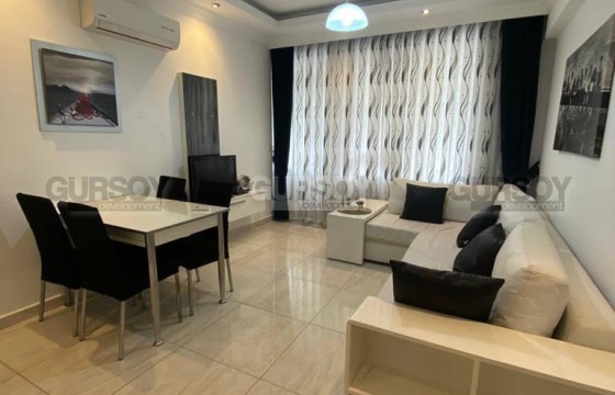 Меблированная квартира 1+1 рядом с пляжем Дамлаташ на Клеопатре в Турции - фото 1