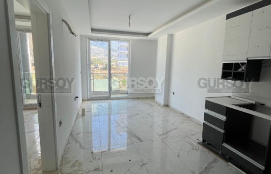 Квартира 1+1 в новом комплексе в Махмутларе — 55 м², 500 м до моря в Турции - фото 5