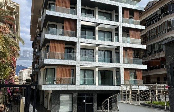 Премиальная квартира 1+1 на первой береговой линии в районе Оба в Турции - фото 1