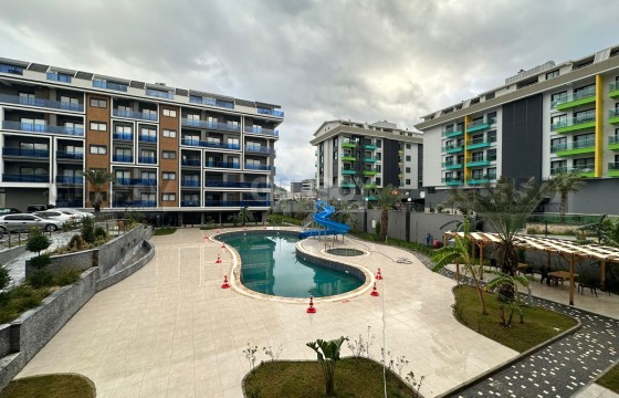 Современная квартира 2+1 для комфортной жизни в зелёном районе Каргыджак в Турции - фото 3