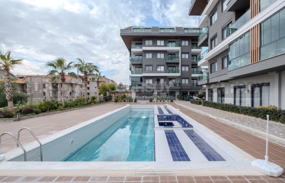 Светлая и уютная квартира 1+1 в современном комплексе по низкой цене в Турции - фото 8