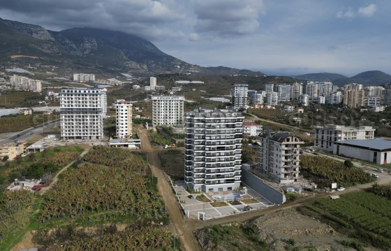 Просторная и светлая квартира в новом комплексе в районе Махмутлар в Турции - фото 2