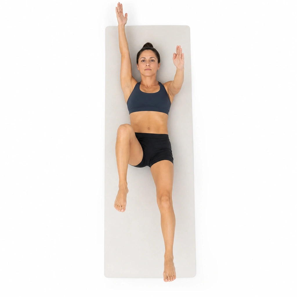Dead Bug (Spine Chain Stability) - Step 2 of 6: Slowly lower your right arm overhead while extending left leg
