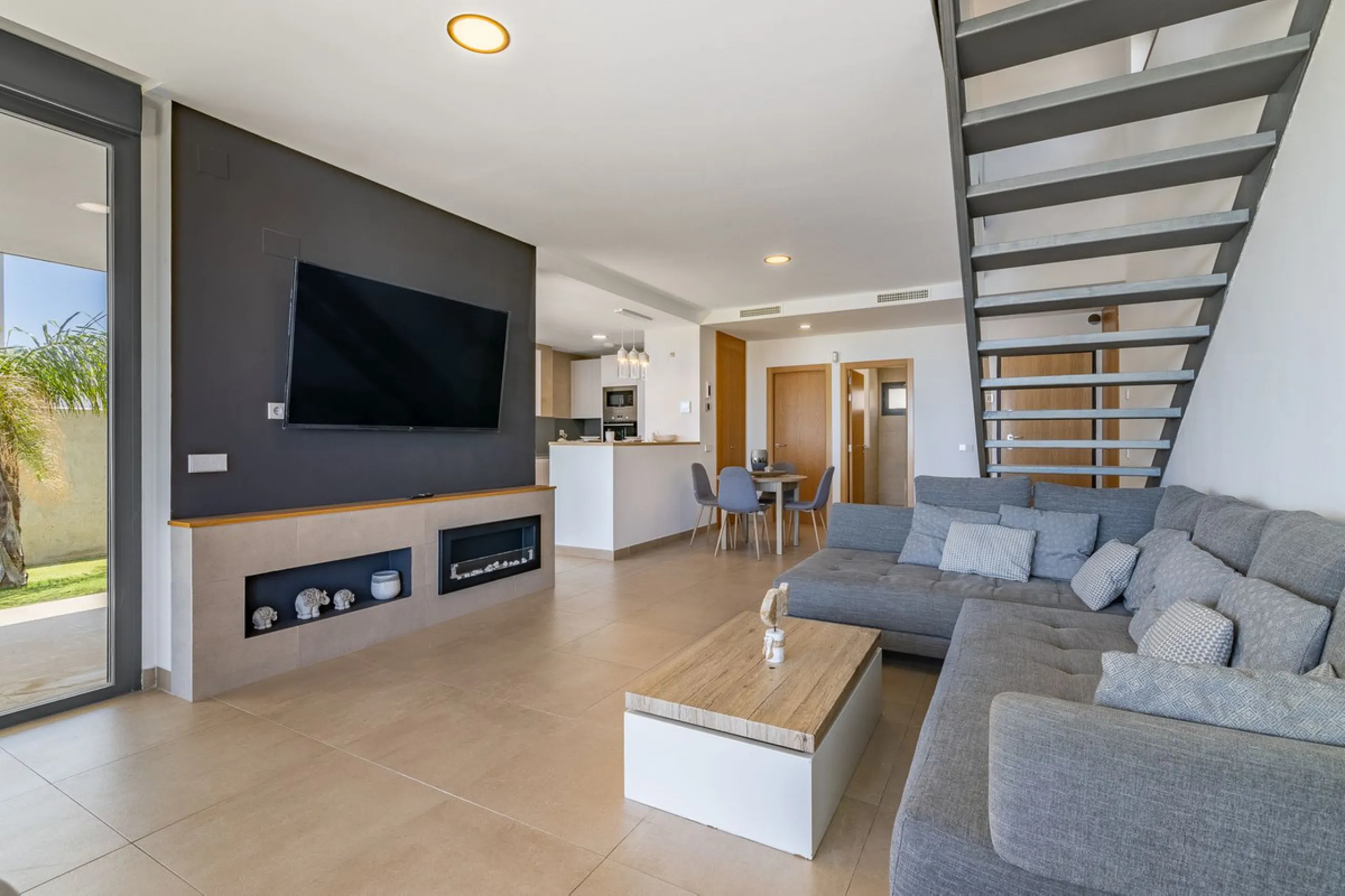This stunning two-story villa boasts four spacious bedrooms, each with fitted wardrobes, electric blinds, and individual air conditioning control. The three elegant bathrooms feature the comfort of underfloor heating.