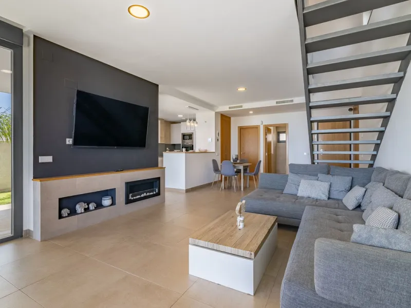 This stunning two-story villa boasts four spacious bedrooms, each with fitted wardrobes, electric blinds, and individual air conditioning control. The three elegant bathrooms feature the comfort of underfloor heating.