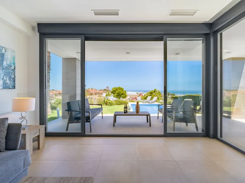 This stunning two-story villa boasts four spacious bedrooms, each with fitted wardrobes, electric blinds, and individual air conditioning control. The three elegant bathrooms feature the comfort of underfloor heating.