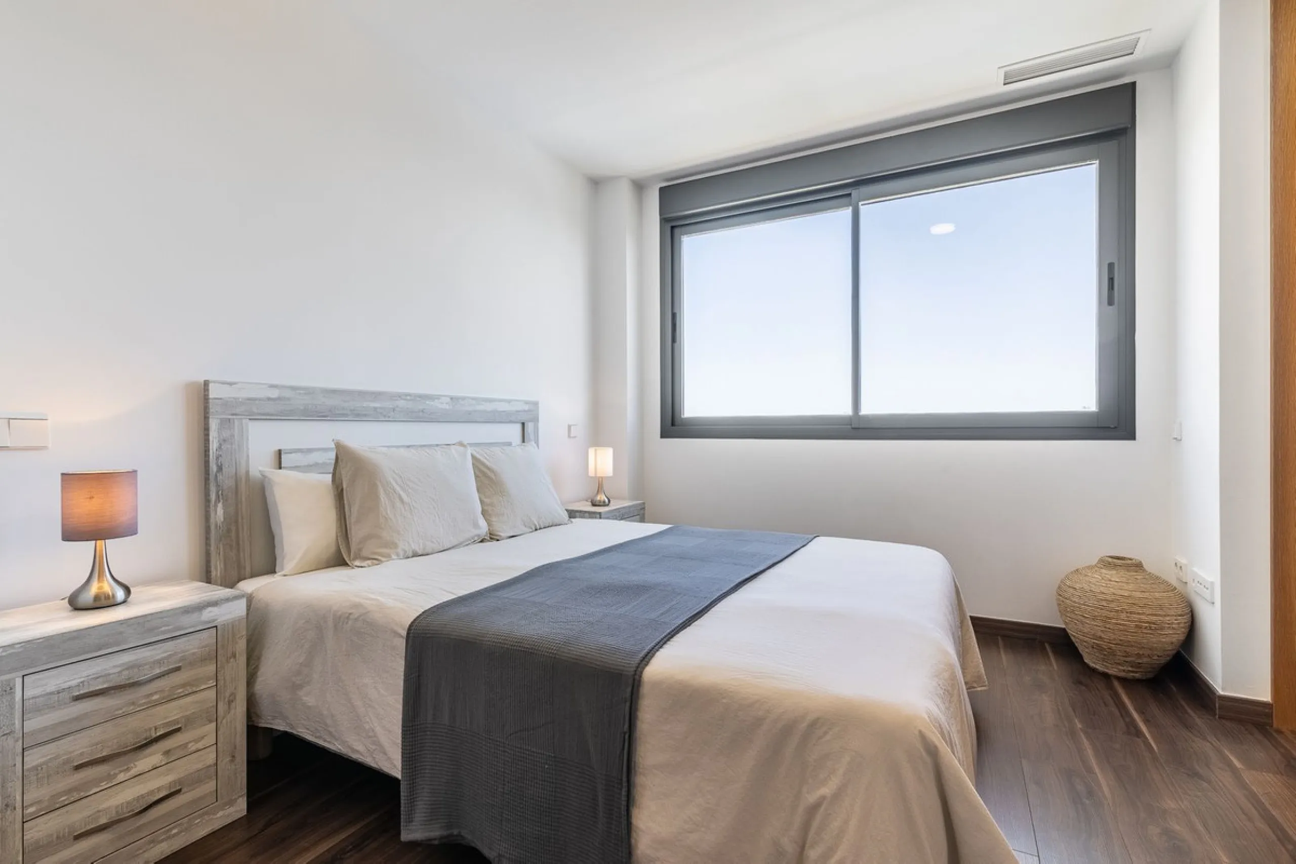 This stunning two-story villa boasts four spacious bedrooms, each with fitted wardrobes, electric blinds, and individual air conditioning control. The three elegant bathrooms feature the comfort of underfloor heating.