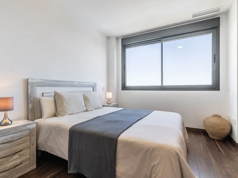 This stunning two-story villa boasts four spacious bedrooms, each with fitted wardrobes, electric blinds, and individual air conditioning control. The three elegant bathrooms feature the comfort of underfloor heating.
