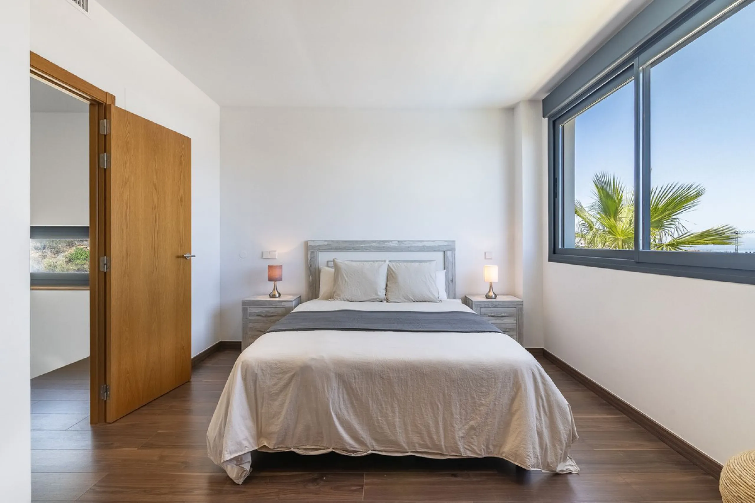This stunning two-story villa boasts four spacious bedrooms, each with fitted wardrobes, electric blinds, and individual air conditioning control. The three elegant bathrooms feature the comfort of underfloor heating.