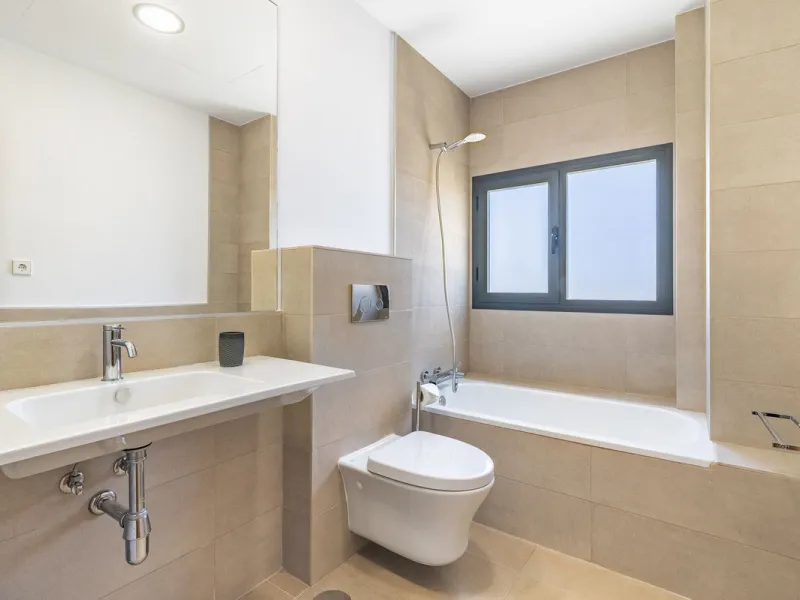 This stunning two-story villa boasts four spacious bedrooms, each with fitted wardrobes, electric blinds, and individual air conditioning control. The three elegant bathrooms feature the comfort of underfloor heating.
