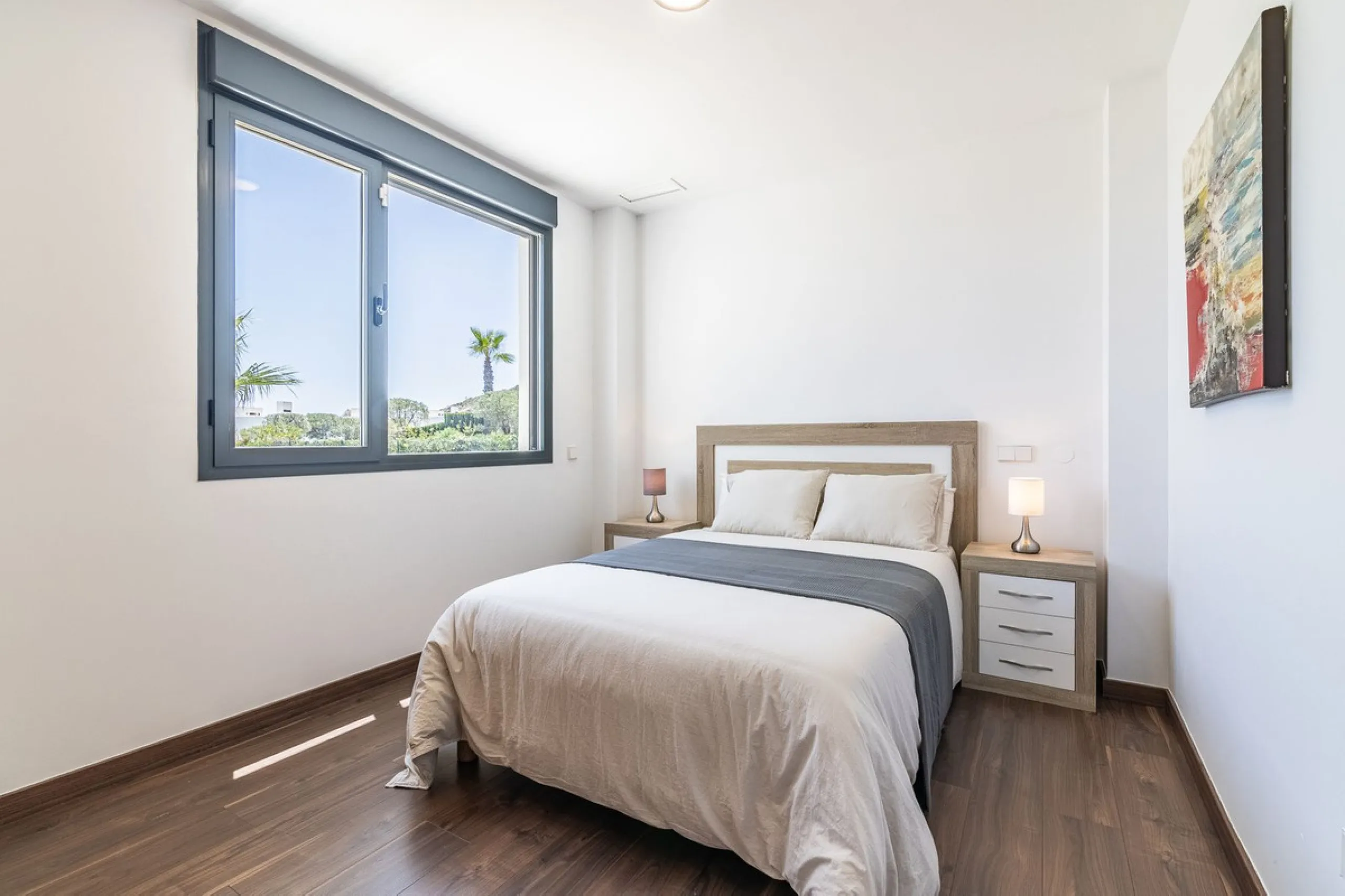 This stunning two-story villa boasts four spacious bedrooms, each with fitted wardrobes, electric blinds, and individual air conditioning control. The three elegant bathrooms feature the comfort of underfloor heating.