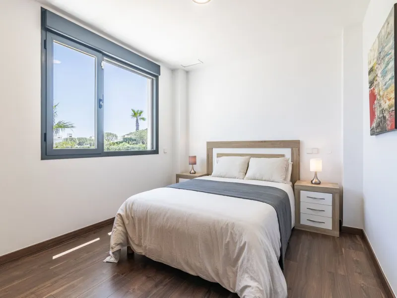 This stunning two-story villa boasts four spacious bedrooms, each with fitted wardrobes, electric blinds, and individual air conditioning control. The three elegant bathrooms feature the comfort of underfloor heating.