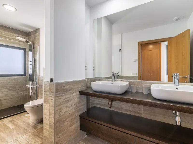 This stunning two-story villa boasts four spacious bedrooms, each with fitted wardrobes, electric blinds, and individual air conditioning control. The three elegant bathrooms feature the comfort of underfloor heating.
