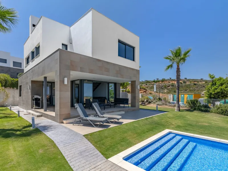 This stunning two-story villa boasts four spacious bedrooms, each with fitted wardrobes, electric blinds, and individual air conditioning control. The three elegant bathrooms feature the comfort of underfloor heating.