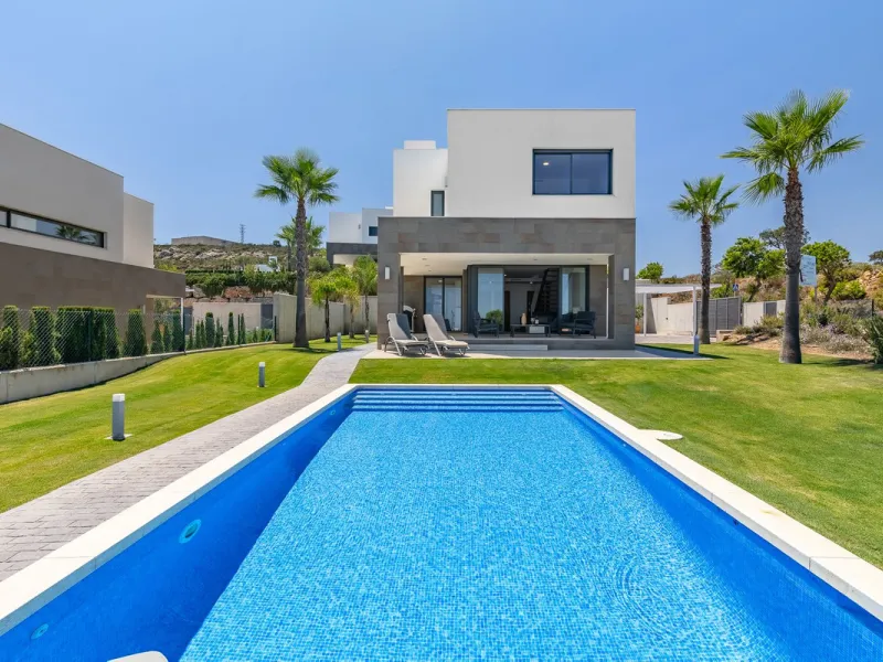 This stunning two-story villa boasts four spacious bedrooms, each with fitted wardrobes, electric blinds, and individual air conditioning control. The three elegant bathrooms feature the comfort of underfloor heating.