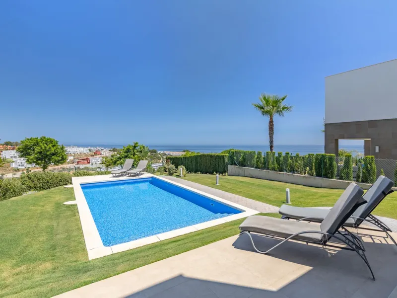 This stunning two-story villa boasts four spacious bedrooms, each with fitted wardrobes, electric blinds, and individual air conditioning control. The three elegant bathrooms feature the comfort of underfloor heating.