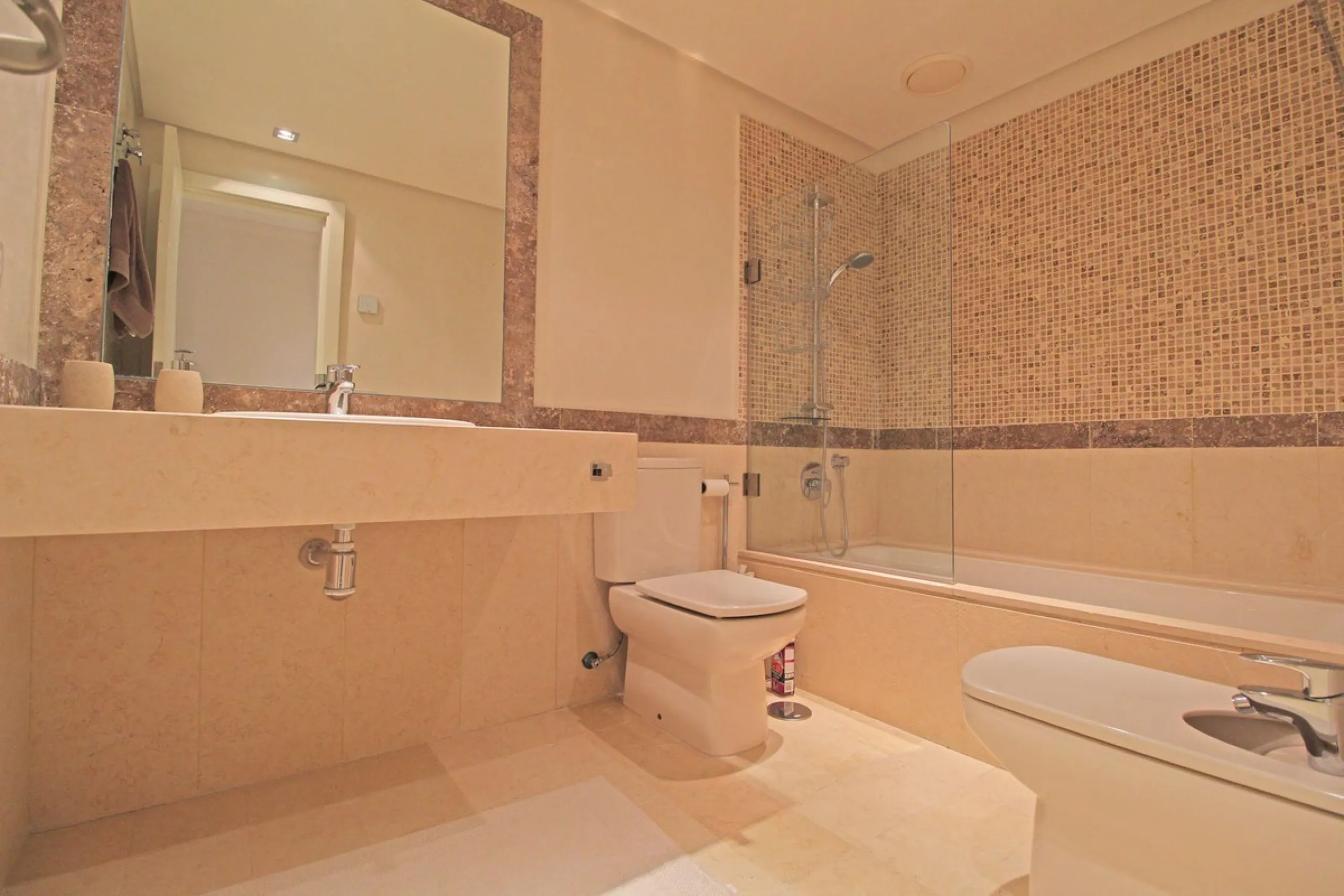 Nestled in the peaceful beachside enclave of Casasola, this charming ground-floor apartment