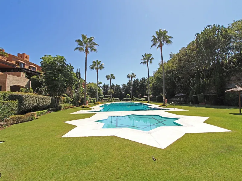 Nestled in the peaceful beachside enclave of Casasola, this charming ground-floor apartment