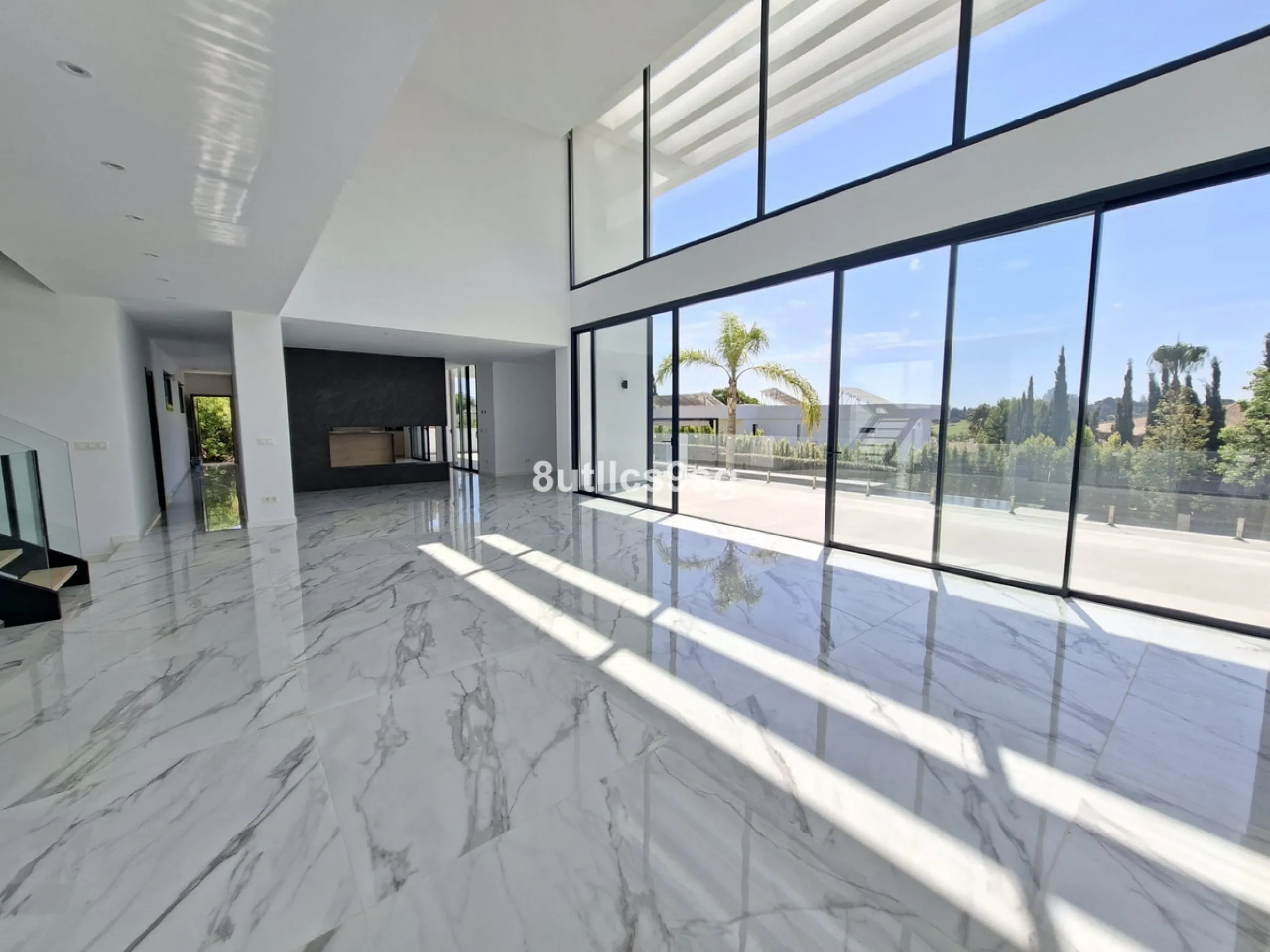 This contemporary villa is situated in the sought-after area of Paraiso Alto, Benahavis, Malaga. The property offers six bedrooms and eight bathrooms, including six en-suite, and stands out for its generous proportions with a built area of 1,038m² and a p