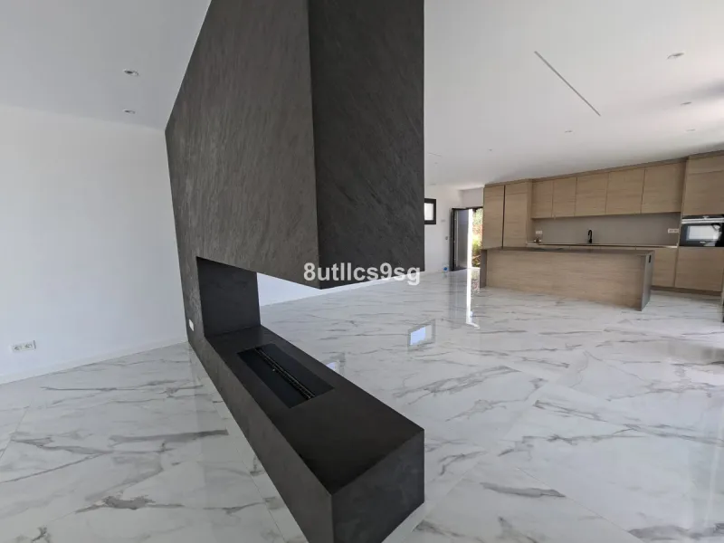 This contemporary villa is situated in the sought-after area of Paraiso Alto, Benahavis, Malaga. The property offers six bedrooms and eight bathrooms, including six en-suite, and stands out for its generous proportions with a built area of 1,038m² and a p