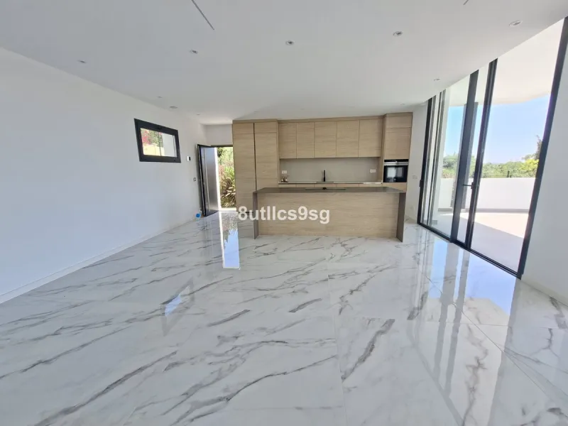 This contemporary villa is situated in the sought-after area of Paraiso Alto, Benahavis, Malaga. The property offers six bedrooms and eight bathrooms, including six en-suite, and stands out for its generous proportions with a built area of 1,038m² and a p