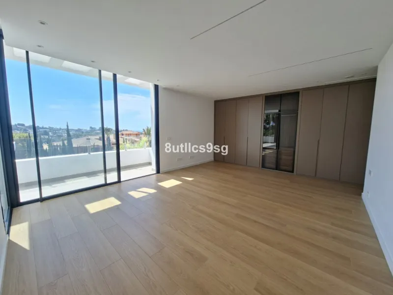 This contemporary villa is situated in the sought-after area of Paraiso Alto, Benahavis, Malaga. The property offers six bedrooms and eight bathrooms, including six en-suite, and stands out for its generous proportions with a built area of 1,038m² and a p