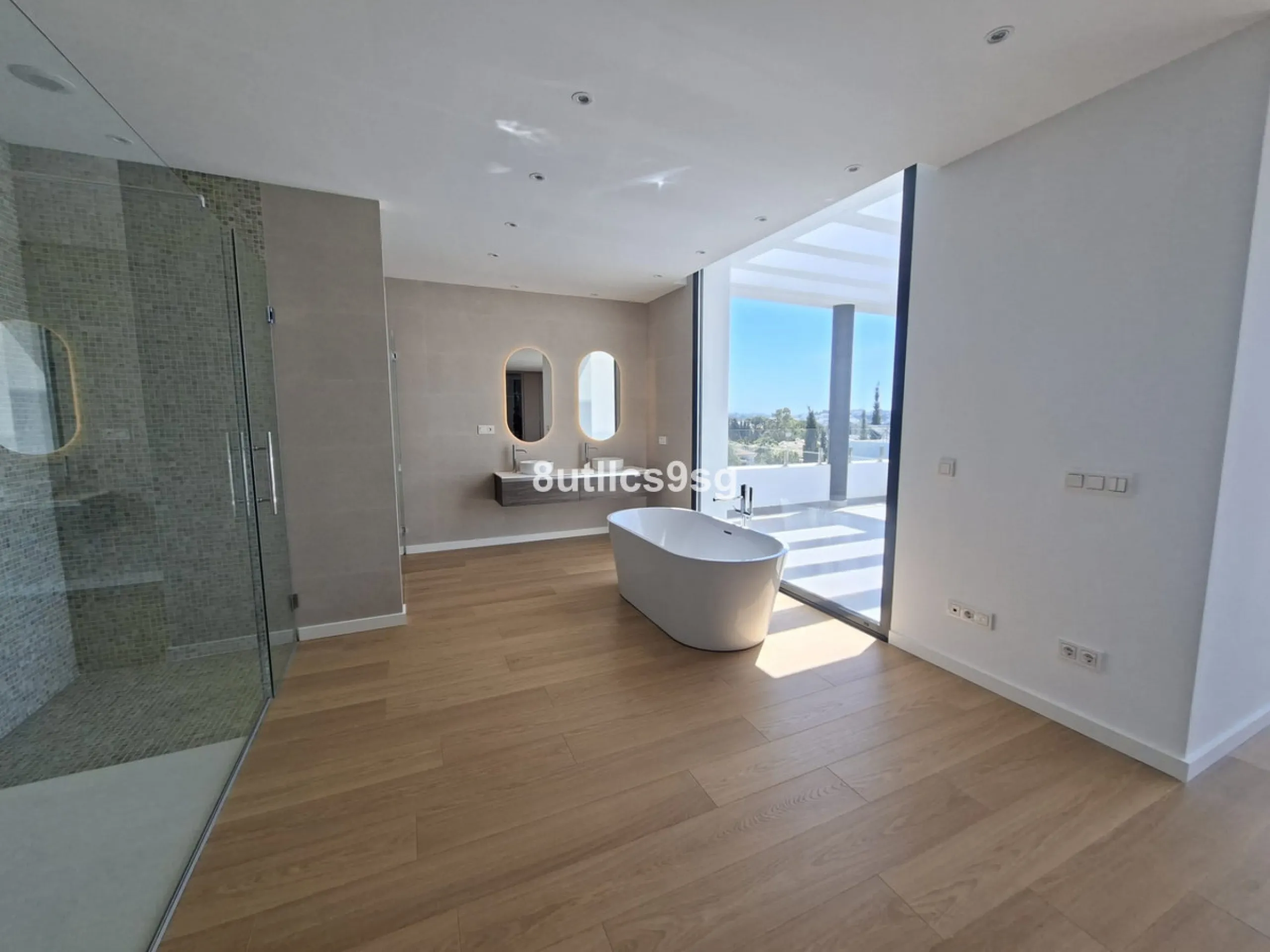 This contemporary villa is situated in the sought-after area of Paraiso Alto, Benahavis, Malaga. The property offers six bedrooms and eight bathrooms, including six en-suite, and stands out for its generous proportions with a built area of 1,038m² and a p